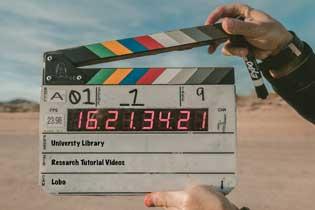 Clapperboard marking the end of a scene.