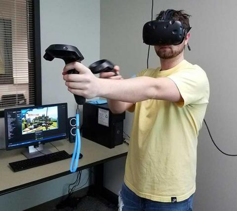 A man wearing the VR goggles