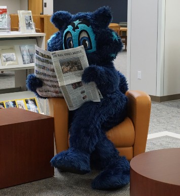 Lobo reading a magazine.