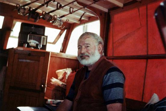 Man sitting in a cabin of a boat.