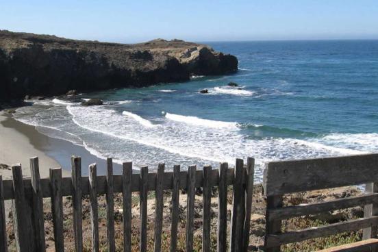 Small wooden fence overlooks the shore