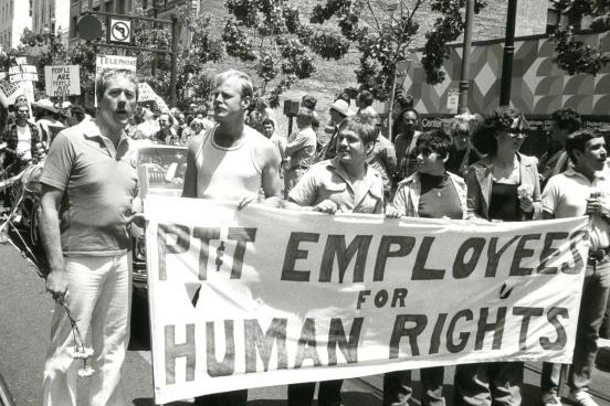 People holding up a banner, PT and T Employees for Human Rights