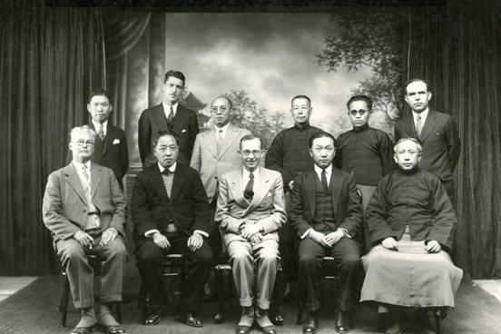 2 rows of men posing for a photo.