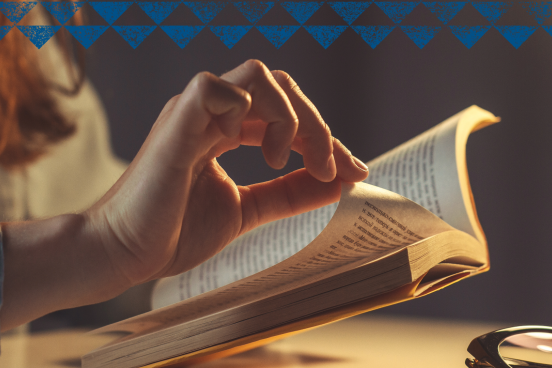 An open book, the single page being turned over.