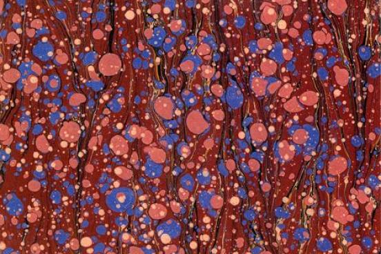 Blue and pink drops on a  red background.