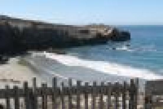 Small fence overlooking ocean.