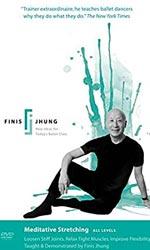 Finis Jhung.  A man sitting on the floor, wearing black.  Looking ahead.