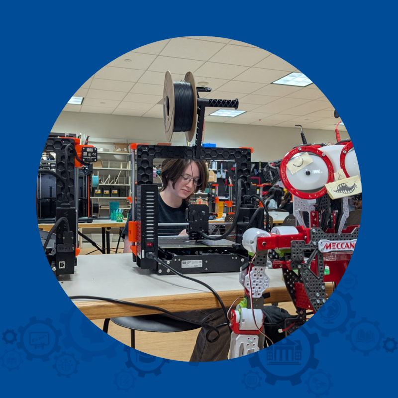 Student working at a 3D printer