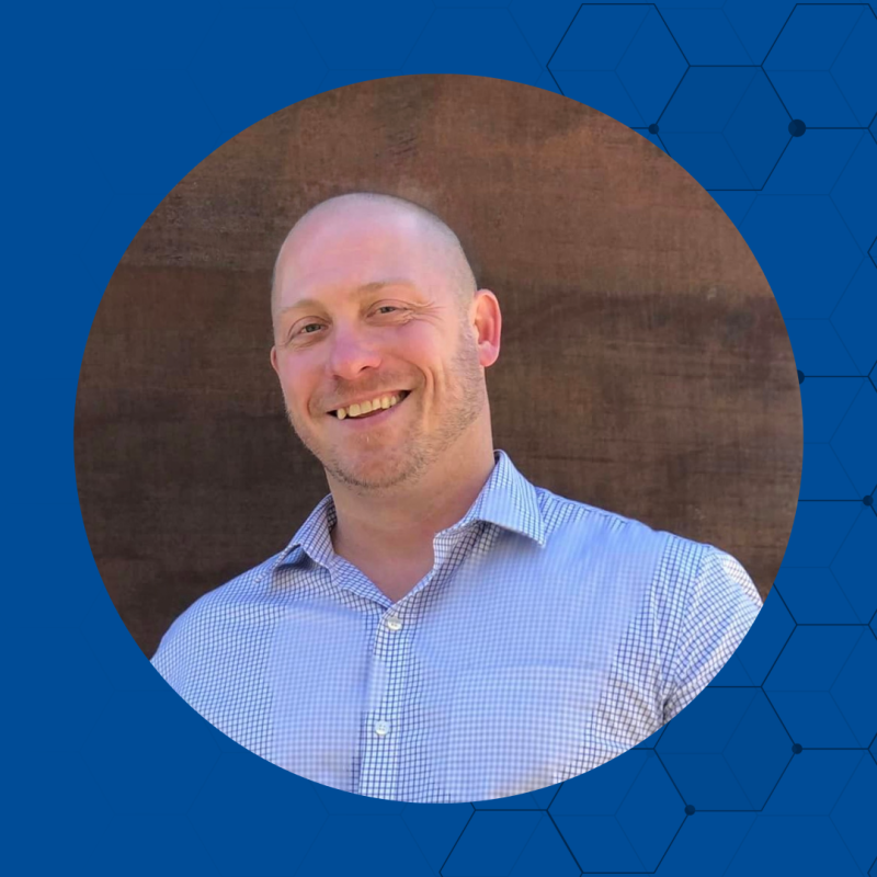 Smiling man looking forward.