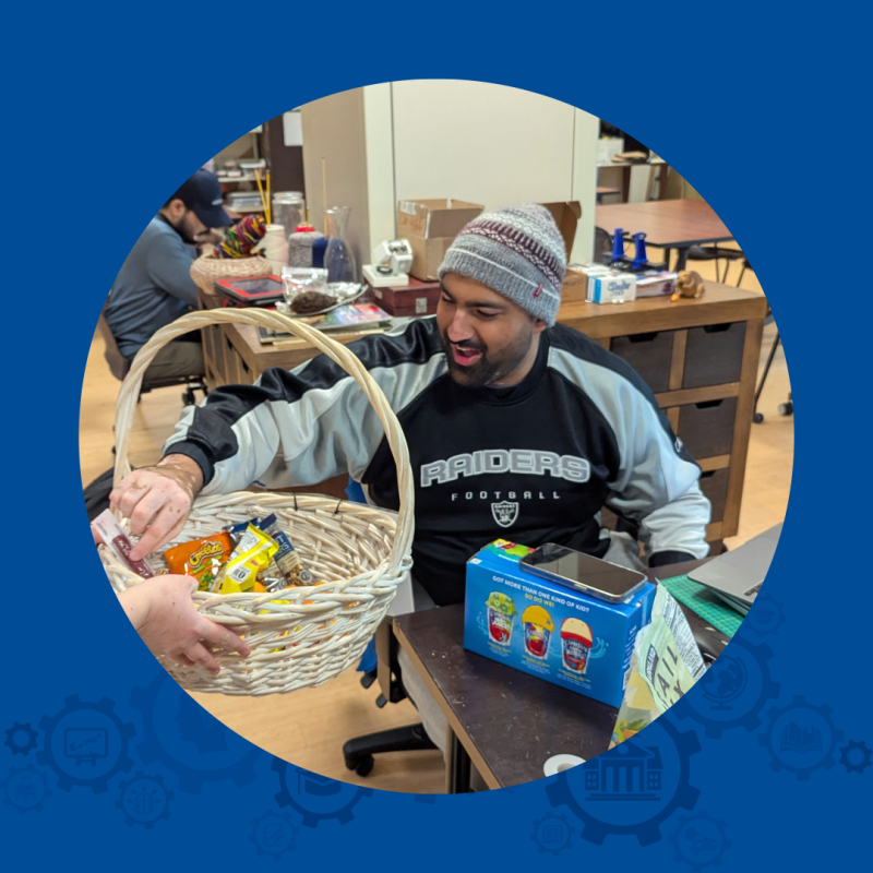 Man reaches into a basket of snacks.