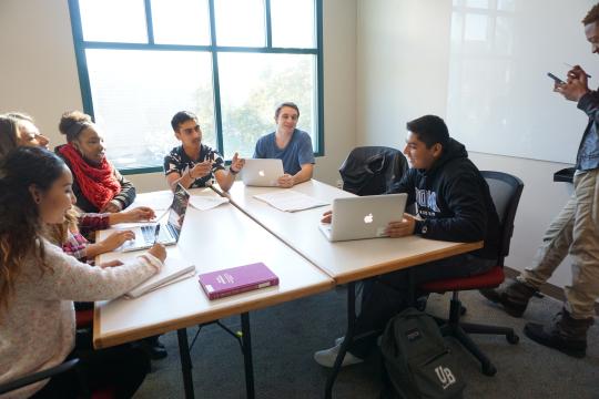 Students studying in a library study room