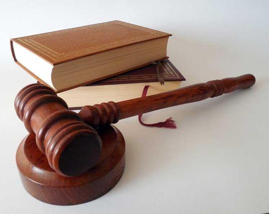Two books and a gavel and sound block.